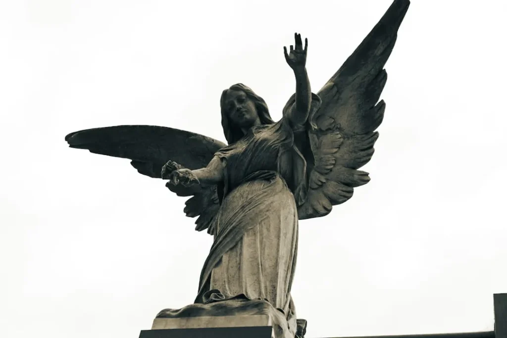 a statue of an angel with outstretched wings