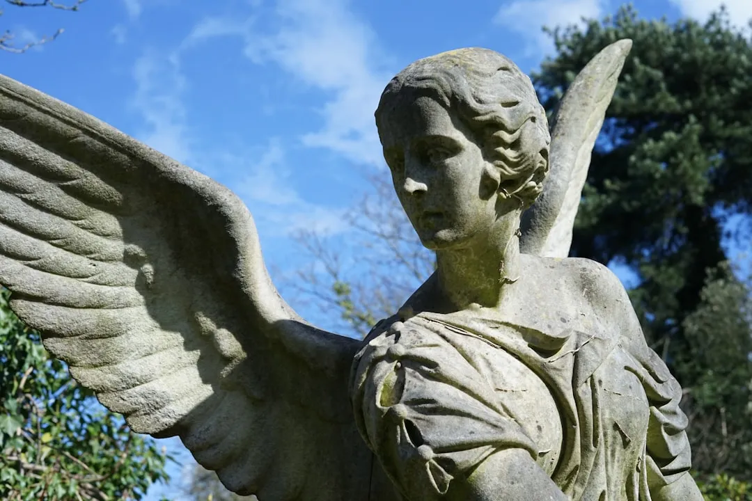 angel statue under blue sky during daytime