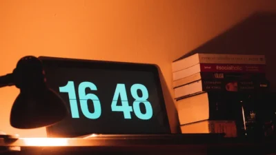 black digital clock reading at 16 48