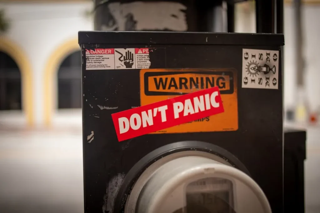A washing machine with a don't panic sticker on it