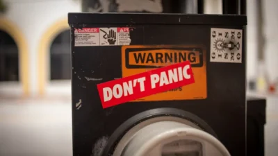 A washing machine with a don't panic sticker on it