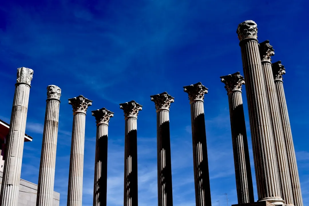 a row of tall stone pillars sitting next to each other