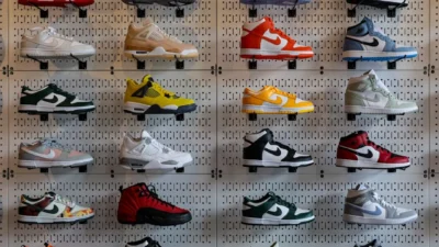 a display of shoes on a wall in a store
