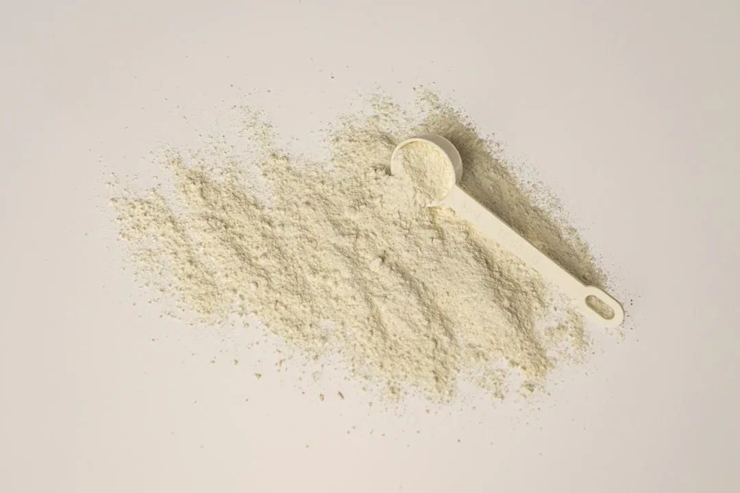 a scoop of powder and a scoop of powder on a white background