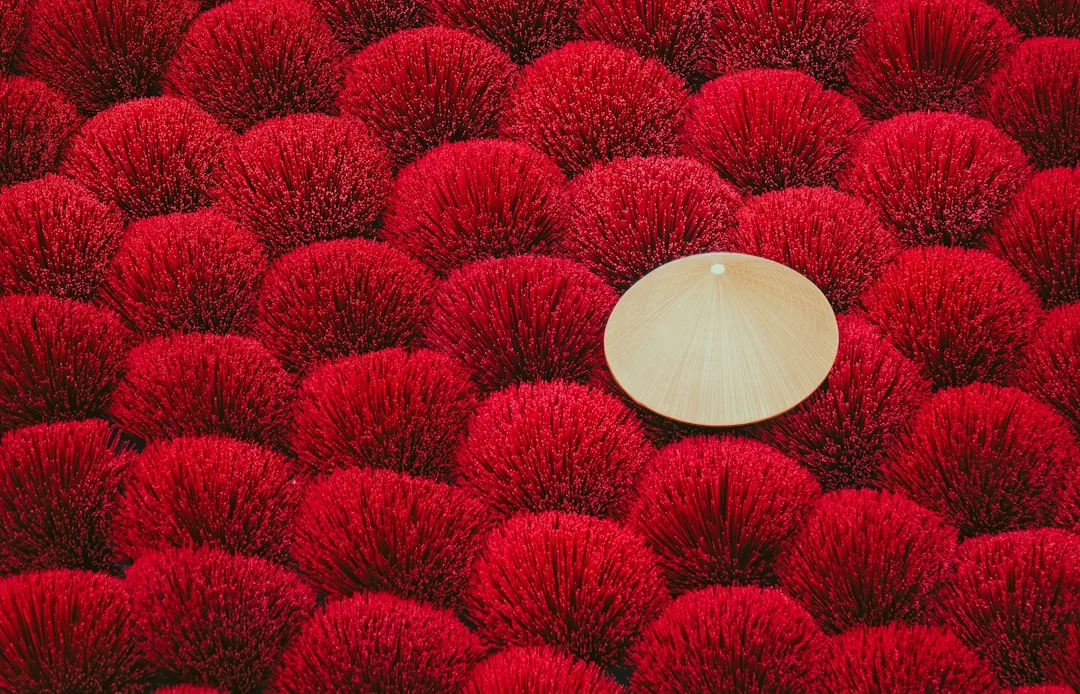 A white object sitting in the middle of a red field