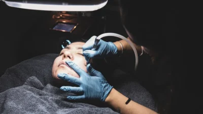 person fixing someone's face