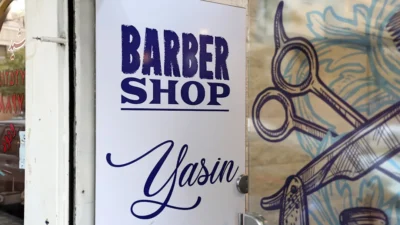 Barber shop sign with scissors illustration
