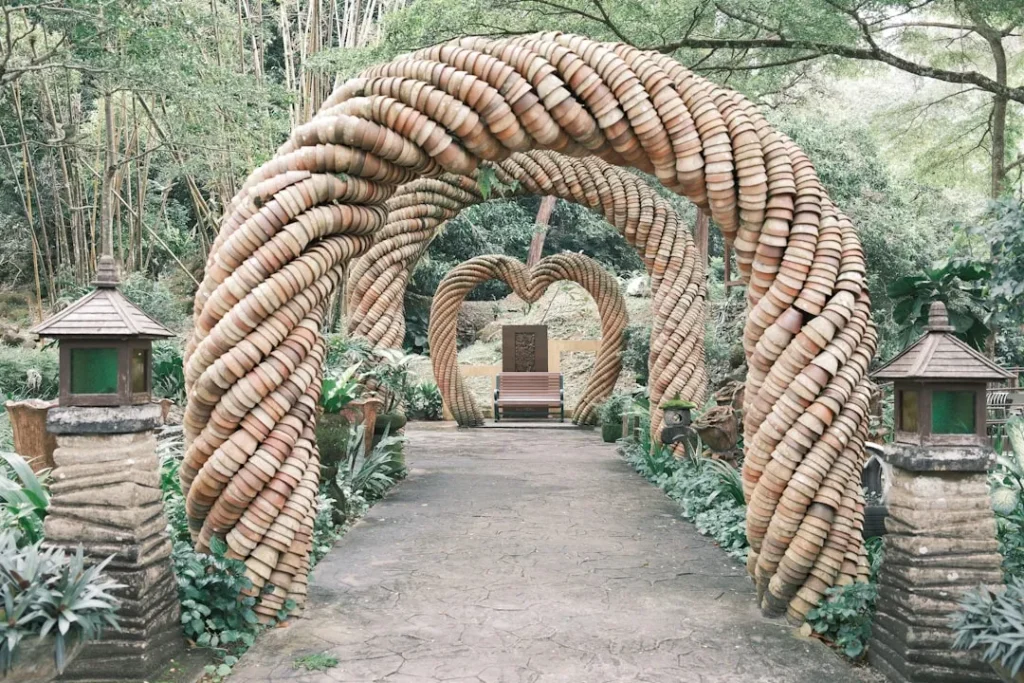 A path with a heart shaped entrance to a garden