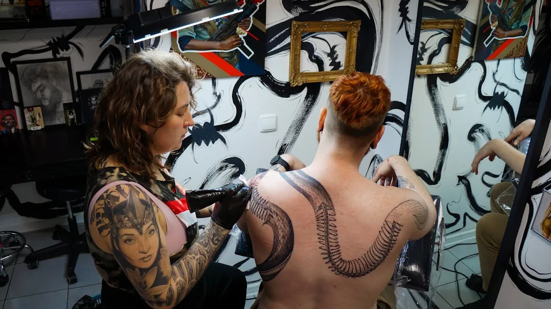 a man and woman with tattoos