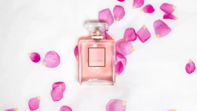 perfume bottle with pink petals