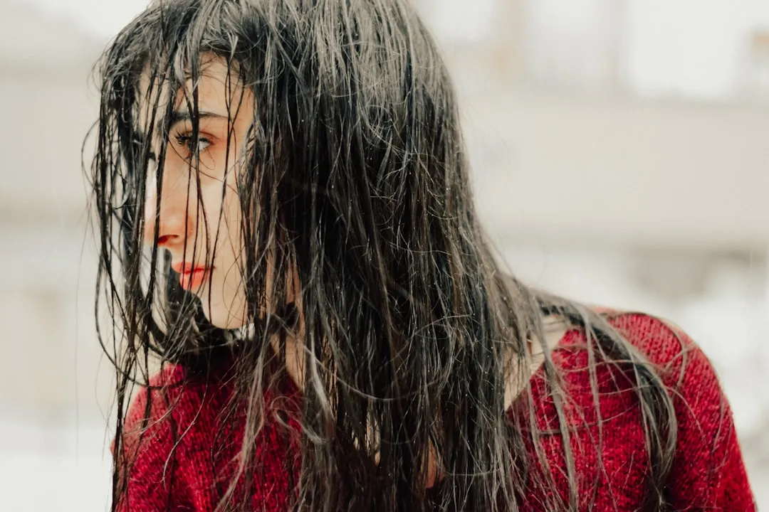 A close up of a woman with wet hair
