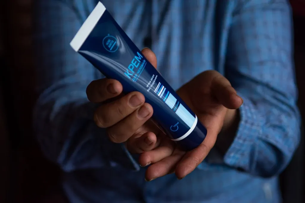 blue and white plastic tube bottle